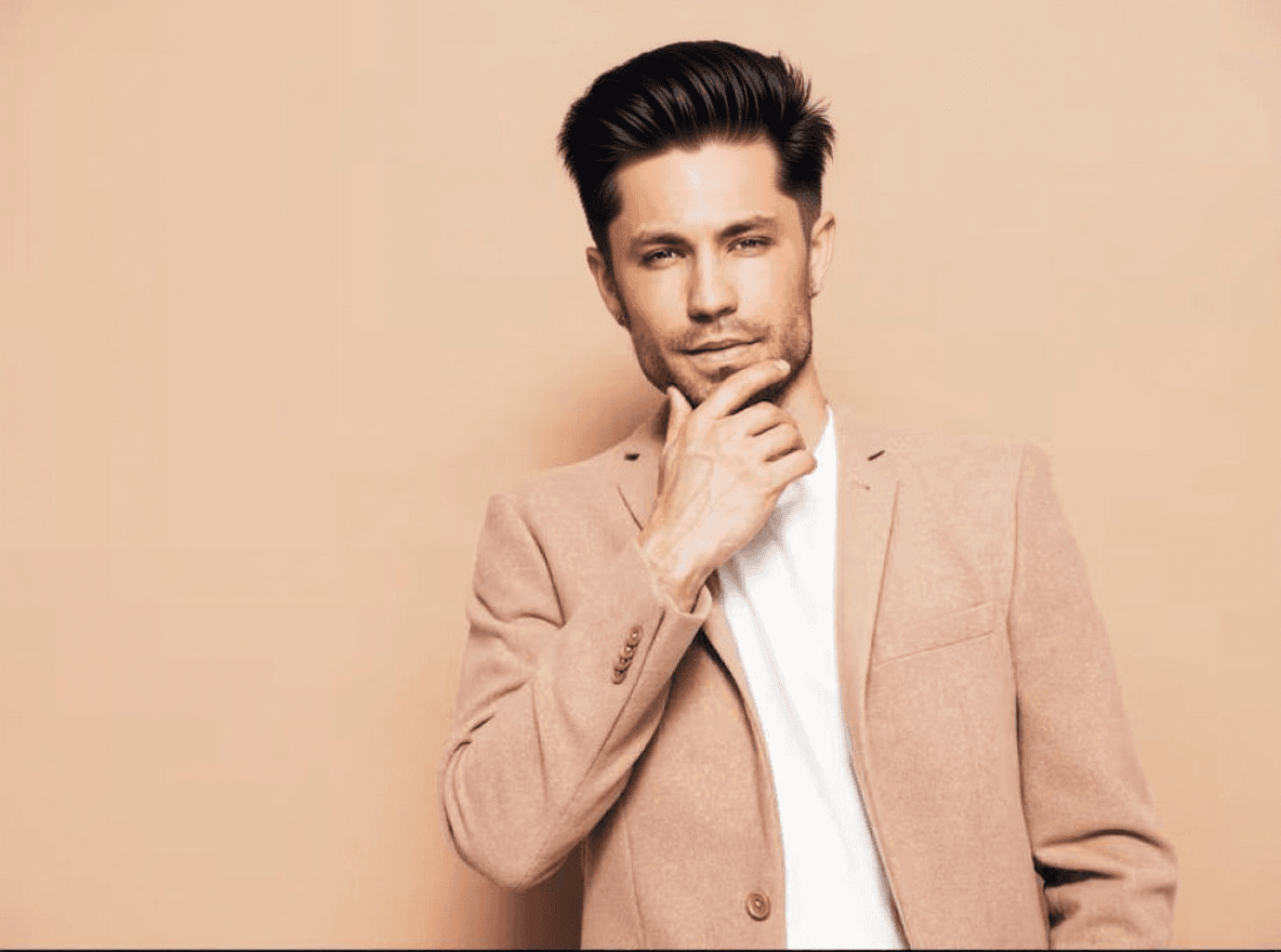 Side part example: hair combed to one side from a crisp parting with tapered sides