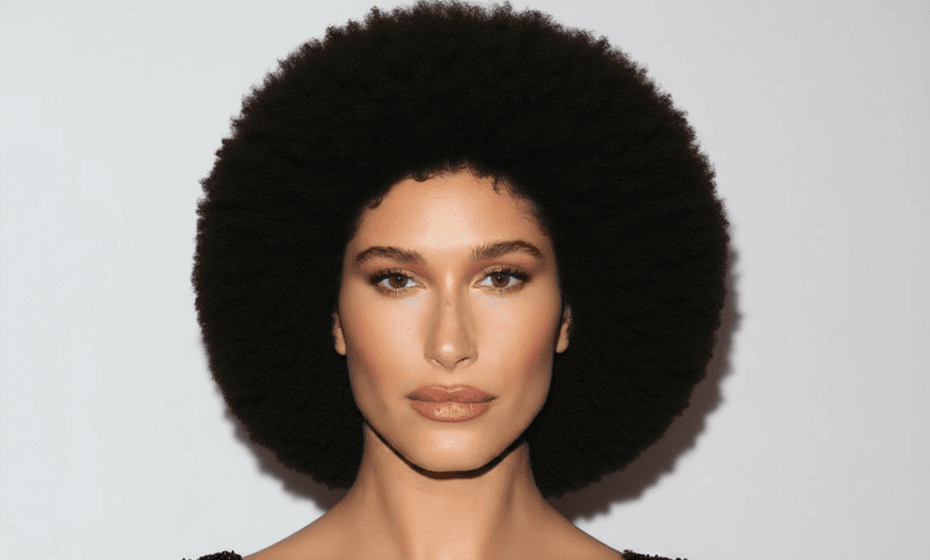 Natural afro example: large rounded afro of dense, tightly coiled curls
